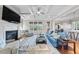 Inviting living room with fireplace, coffered ceiling, and abundant natural light at 3 Alumwood Pl, Durham, NC 27705