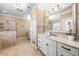 Luxurious main bathroom features a granite-topped vanity and tiled walk-in shower at 3 Alumwood Pl, Durham, NC 27705
