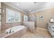 Relaxing main bathroom features a tub and tiled shower at 3 Alumwood Pl, Durham, NC 27705