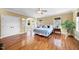 Spacious main bedroom with wood floors, a ceiling fan, and lots of natural light at 3 Alumwood Pl, Durham, NC 27705