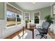Bright office features three large windows, white wainscoting, and wood floors at 3 Alumwood Pl, Durham, NC 27705