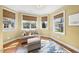 Cozy sitting room has natural light, hardwood floors, and comfortable seating at 3 Alumwood Pl, Durham, NC 27705