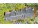 Overhead view of the townhouses showcasing the rooftops, decks, parking areas, and lush green surroundings at 3111 Coachmans Way, Durham, NC 27705