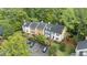 Aerial view of a townhouse community with landscaped grounds and parking at 3111 Coachmans Way, Durham, NC 27705