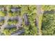 Overhead view of a townhouse complex with parking and lush green landscaping surrounded by trees at 3111 Coachmans Way, Durham, NC 27705