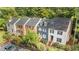 Aerial view of townhouses showcasing landscaping, parking, and neighborhood at 3111 Coachmans Way, Durham, NC 27705