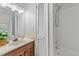 Bathroom showcasing a vanity with plants and vanity with a full shower-tub combo at 3111 Coachmans Way, Durham, NC 27705