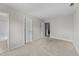 Bedroom featuring neutral walls and carpet along with a bathroom entry and closet at 3111 Coachmans Way, Durham, NC 27705