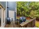 Cozy outdoor deck with comfortable seating, ideal for relaxation and enjoying the surrounding greenery at 3111 Coachmans Way, Durham, NC 27705