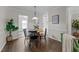 Cozy dining room featuring wood floors and open access to the living spaces at 3111 Coachmans Way, Durham, NC 27705