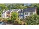 Row of townhouses with varied exteriors and well-maintained landscaping at 3111 Coachmans Way, Durham, NC 27705