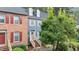 Townhouse featuring blue siding, dormer windows, and a welcoming front entrance at 3111 Coachmans Way, Durham, NC 27705