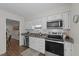Traditional kitchen with white cabinets, subway tile backsplash, granite countertops and stainless steel appliances at 3111 Coachmans Way, Durham, NC 27705
