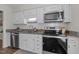 Traditional kitchen with white cabinets, subway tile backsplash, granite countertops and stainless steel appliances at 3111 Coachmans Way, Durham, NC 27705