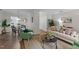 Open living space with a view of the dining area, featuring stylish furnishings and wood flooring at 3111 Coachmans Way, Durham, NC 27705