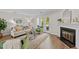 Bright living room with fireplace, modern furniture, and outdoor patio access at 3111 Coachmans Way, Durham, NC 27705