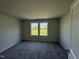 Bedroom featuring two windows offering green views at 325 Magnolia Run Way, Benson, NC 27504
