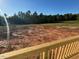 Expansive backyard featuring a partially cleared lot ready for landscaping or outdoor activities against a treeline backdrop at 35 Calabria Ct, Franklinton, NC 27525