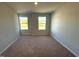 Bedroom with carpeted floors and bright windows at 35 Calabria Ct, Franklinton, NC 27525