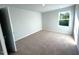 Bright bedroom with carpeted floors and a large window at 35 Calabria Ct, Franklinton, NC 27525