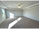 Spacious bedroom featuring a trey ceiling, carpet, and natural light at 35 Calabria Ct, Franklinton, NC 27525
