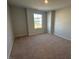 Cozy bedroom with neutral walls and carpeted floors at 35 Calabria Ct, Franklinton, NC 27525