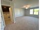 Open bonus room with dark cabinets and large windows for natural light at 35 Calabria Ct, Franklinton, NC 27525