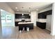 New kitchen features dark cabinets, an island with white countertop, and stainless steel appliances at 35 Calabria Ct, Franklinton, NC 27525