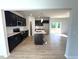 Kitchen view showcasing the island, stainless steel appliances, and dark cabinetry at 35 Calabria Ct, Franklinton, NC 27525