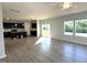 Spacious living room adjacent to kitchen with sliding glass doors and large windows at 35 Calabria Ct, Franklinton, NC 27525