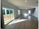 Spacious living room with sliding glass door leading to a deck at 35 Calabria Ct, Franklinton, NC 27525