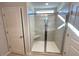 Walk-in tiled shower stall with glass doors and a built-in seat at 35 Calabria Ct, Franklinton, NC 27525
