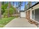 Spacious backyard patio, featuring a brick home exterior, and mature trees at 3910 Hillgrand Dr, Durham, NC 27705