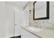 Modern bathroom with stone mosaic wall, undermount sink, and granite counter at 3910 Hillgrand Dr, Durham, NC 27705