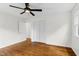 Bedroom with hardwood floors, ceiling fan, and access to bath at 3910 Hillgrand Dr, Durham, NC 27705