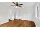 Bedroom featuring hardwood floors, ceiling fan, closet, and access to bath at 3910 Hillgrand Dr, Durham, NC 27705