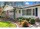 Charming single-story home featuring a brick facade, manicured lawn, and lovely landscaping at 3910 Hillgrand Dr, Durham, NC 27705