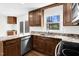 Updated kitchen featuring granite countertops, stainless steel appliances, and wooden cabinetry at 3910 Hillgrand Dr, Durham, NC 27705