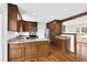Open kitchen with granite countertops, wooden cabinets, and stainless steel appliances at 3910 Hillgrand Dr, Durham, NC 27705