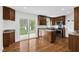Bright kitchen with stainless steel appliances, granite countertops, and sliding glass door to backyard at 3910 Hillgrand Dr, Durham, NC 27705