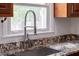 Granite countertops and stainless steel sink in updated kitchen at 3910 Hillgrand Dr, Durham, NC 27705