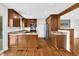 Spacious kitchen featuring wooden cabinets, stainless steel appliances, and granite countertops at 3910 Hillgrand Dr, Durham, NC 27705