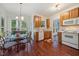 Eat-in kitchen featuring wood cabinets, stainless steel appliances and a breakfast nook at 4070 Landover Ln, Raleigh, NC 27616