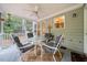 Comfortable screened porch with outdoor seating and ceiling fan at 4070 Landover Ln, Raleigh, NC 27616