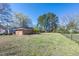 Spacious fenced backyard with lush trees, offering privacy and room for outdoor activities at 412 Suburb St, Rocky Mount, NC 27801