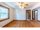 Bright bedroom featuring hardwood floors, a ceiling fan, and generous natural light at 412 Suburb St, Rocky Mount, NC 27801
