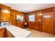 Classic kitchen with wood paneling, granite countertops, and modern appliances at 412 Suburb St, Rocky Mount, NC 27801