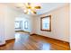 Bright living room with hardwood floors, ceiling fan, and natural light from windows at 412 Suburb St, Rocky Mount, NC 27801