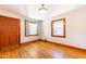 Inviting living room with wood door, hardwood floors, and large windows at 412 Suburb St, Rocky Mount, NC 27801