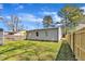 Home backyard with green grass and wood fence at 43 Nordan St, Angier, NC 27501